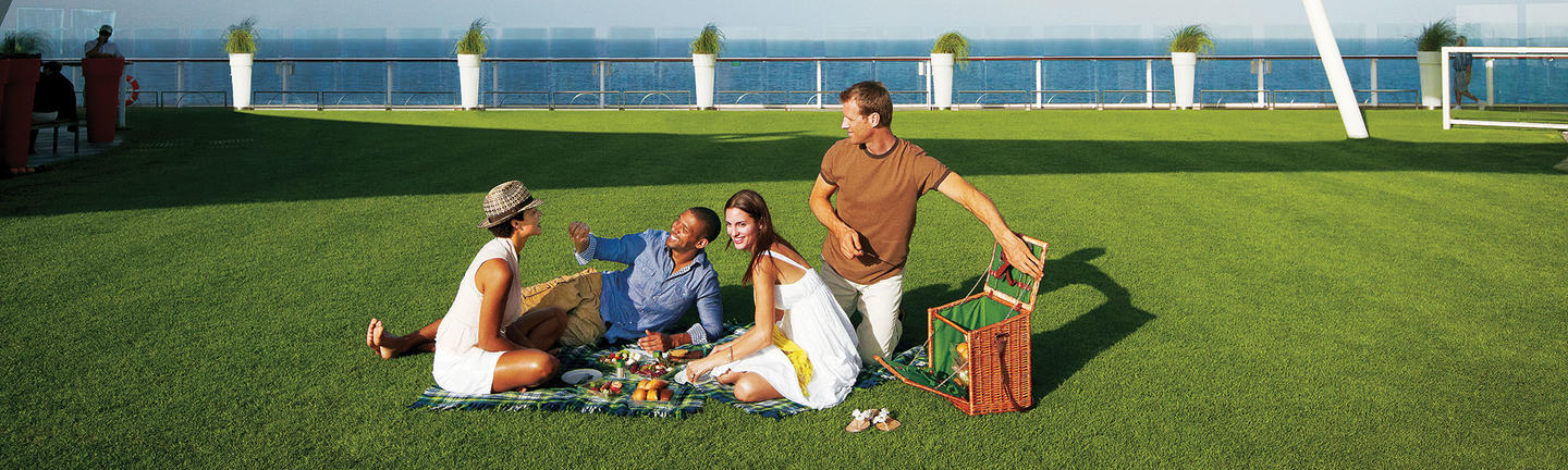 Couples at the Lawn Club onboard Celebrity Cruises 