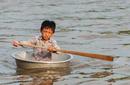 Kid Paddling, Tonle Lake Floating Village | By Flight Centre&#039;s Ken Ng