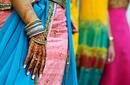 Brightly coloured saris and henna tattoos